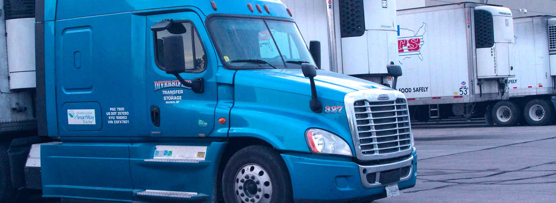 DTS Trucking Recruitment A DTS semi tractor parked outside a temp-control warehouse facility in Denver, Colorado.