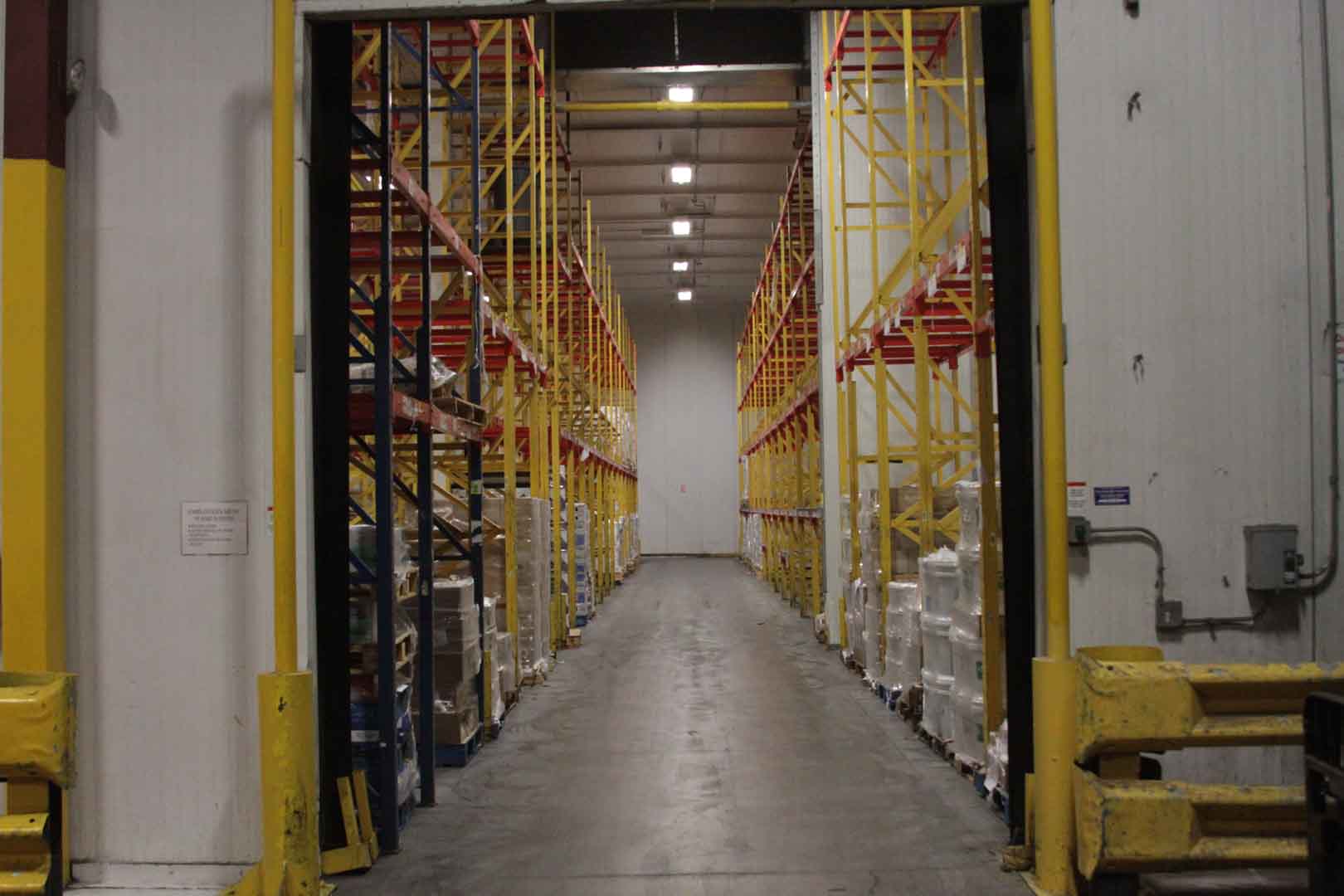 Denver Chill Dock A picture showing a motorized overhead door, open and leading to a temperature control warehouse.