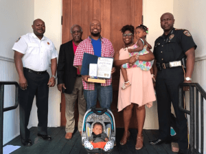 Barry Williams, his wife, Kala, and 2 children, Kennedy and Kendall, as Barry Williams is presented with awards for his heroic deed.