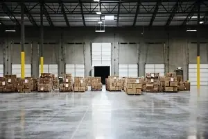 cardboard boxes at loading dock in warehouse