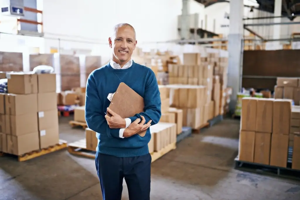 let me handle the logistics portrait of a mature man standing in a distribution warehouse